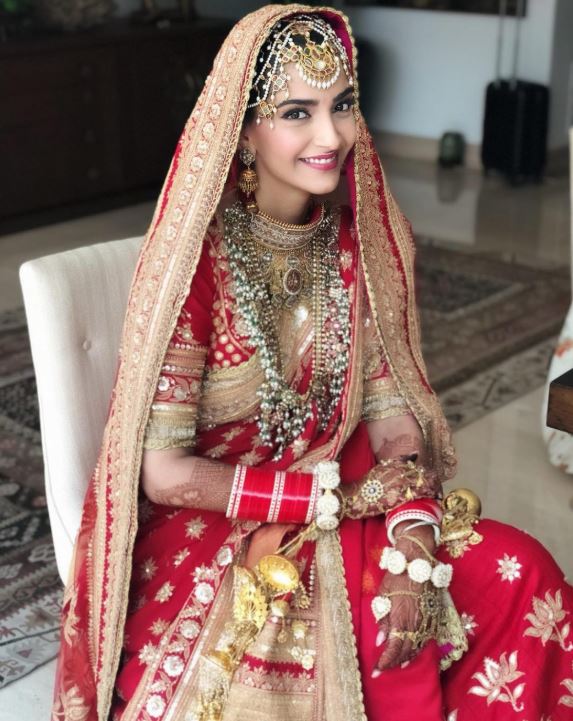 sonam kapoor ahuja wedding pics bridal lehenga look dress